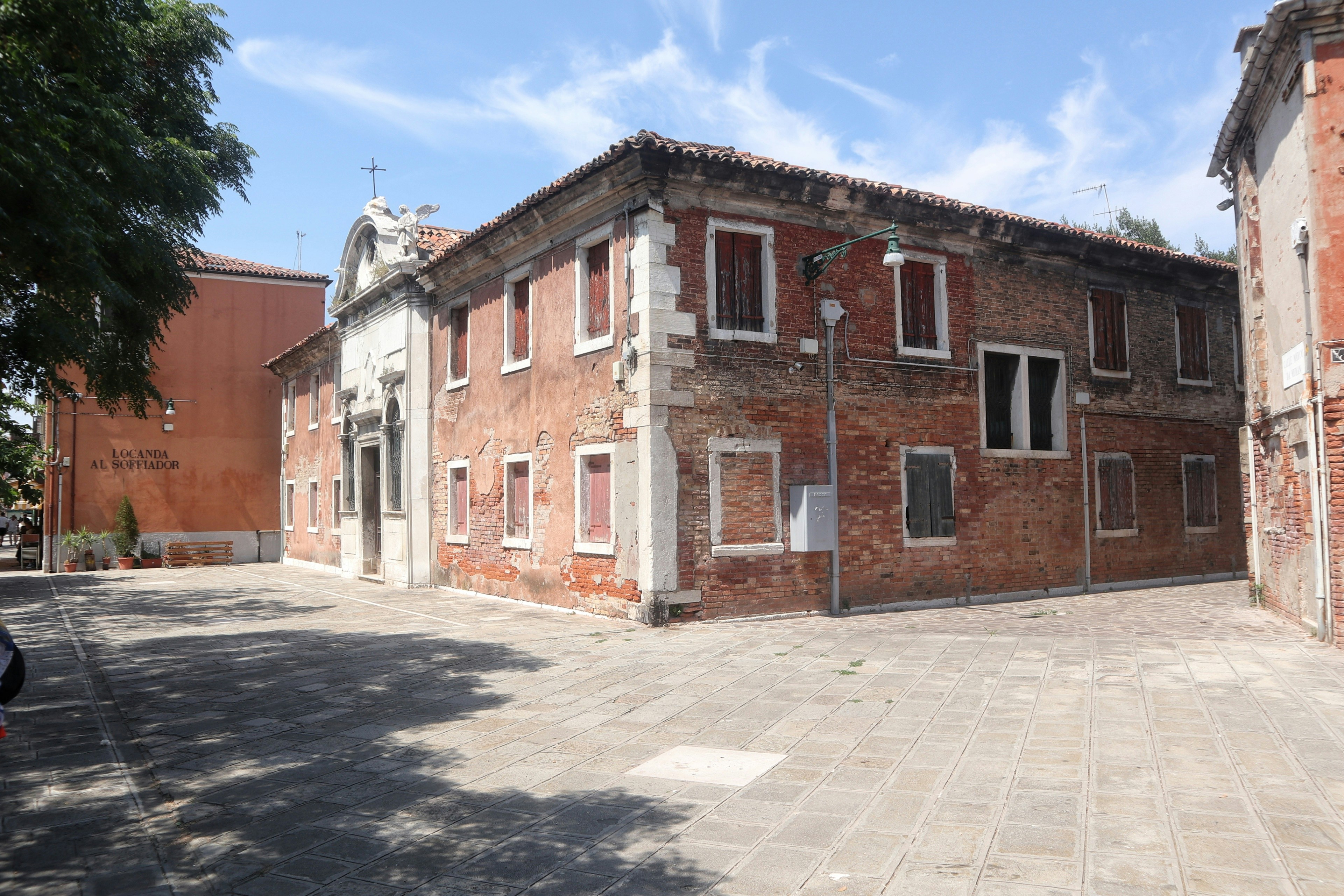 A large brick building sitting on the side of a road