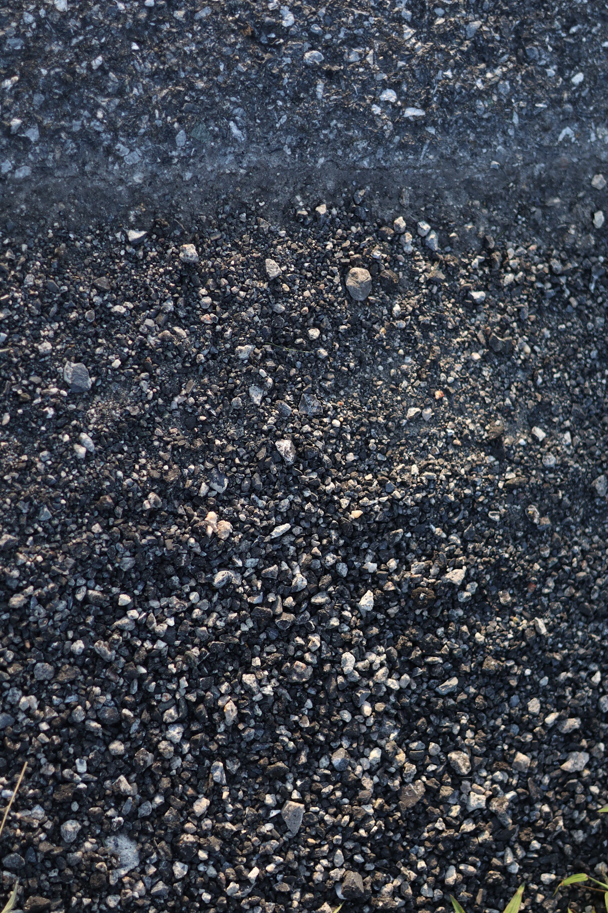 A red fire hydrant spewing water on a street