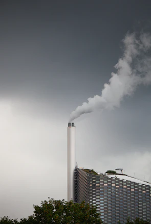 A smokestack emits from the top of a building