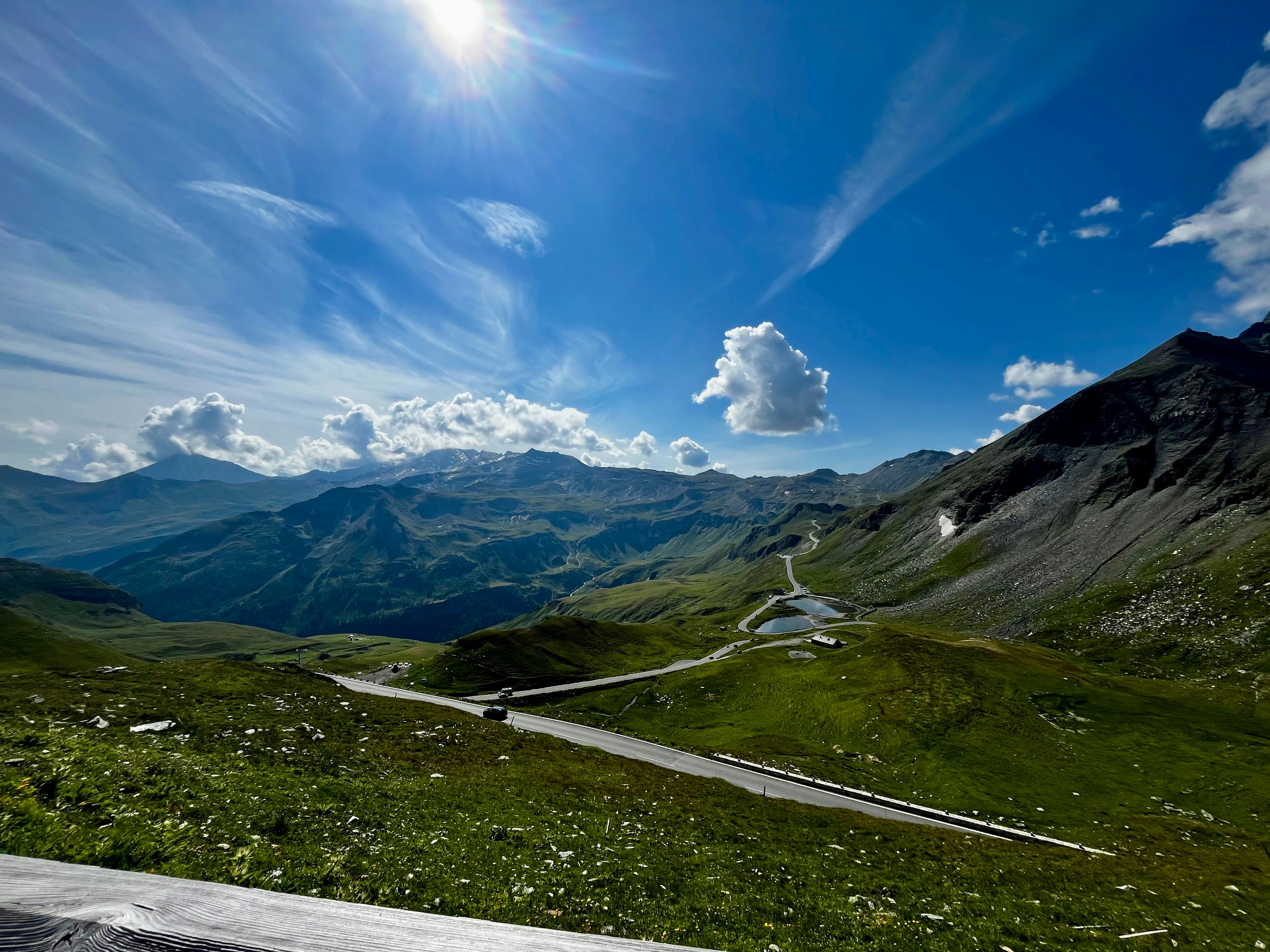 A scenic view of a winding road in the mountains