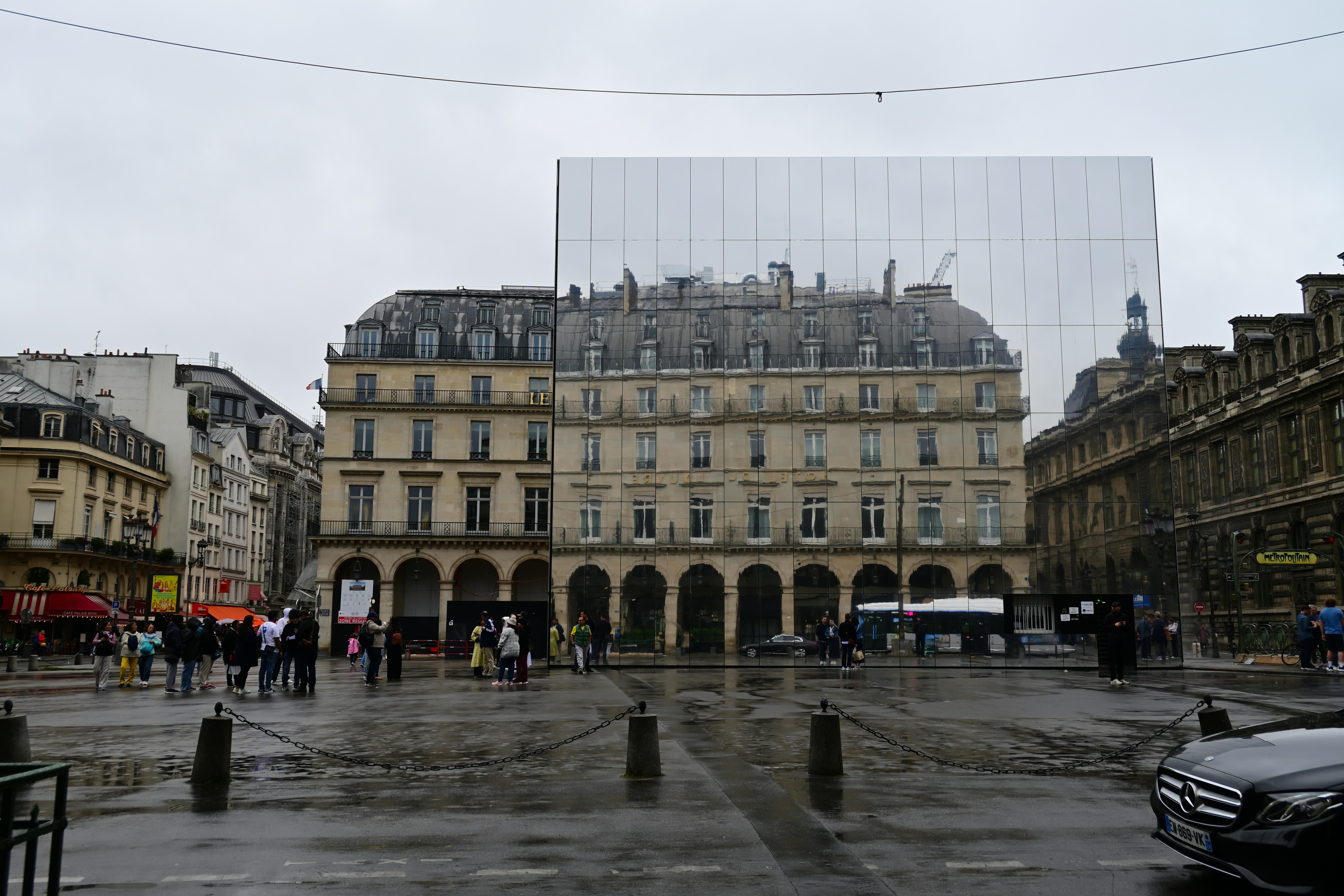 A city square with a large building in the background