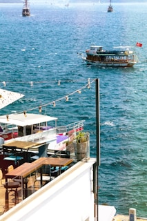 A group of boats floating on top of a large body of water