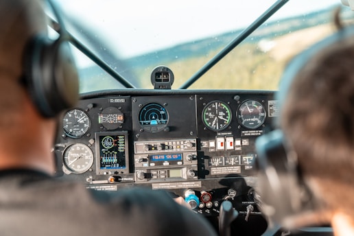 A man sitting in the cockpit of a plane