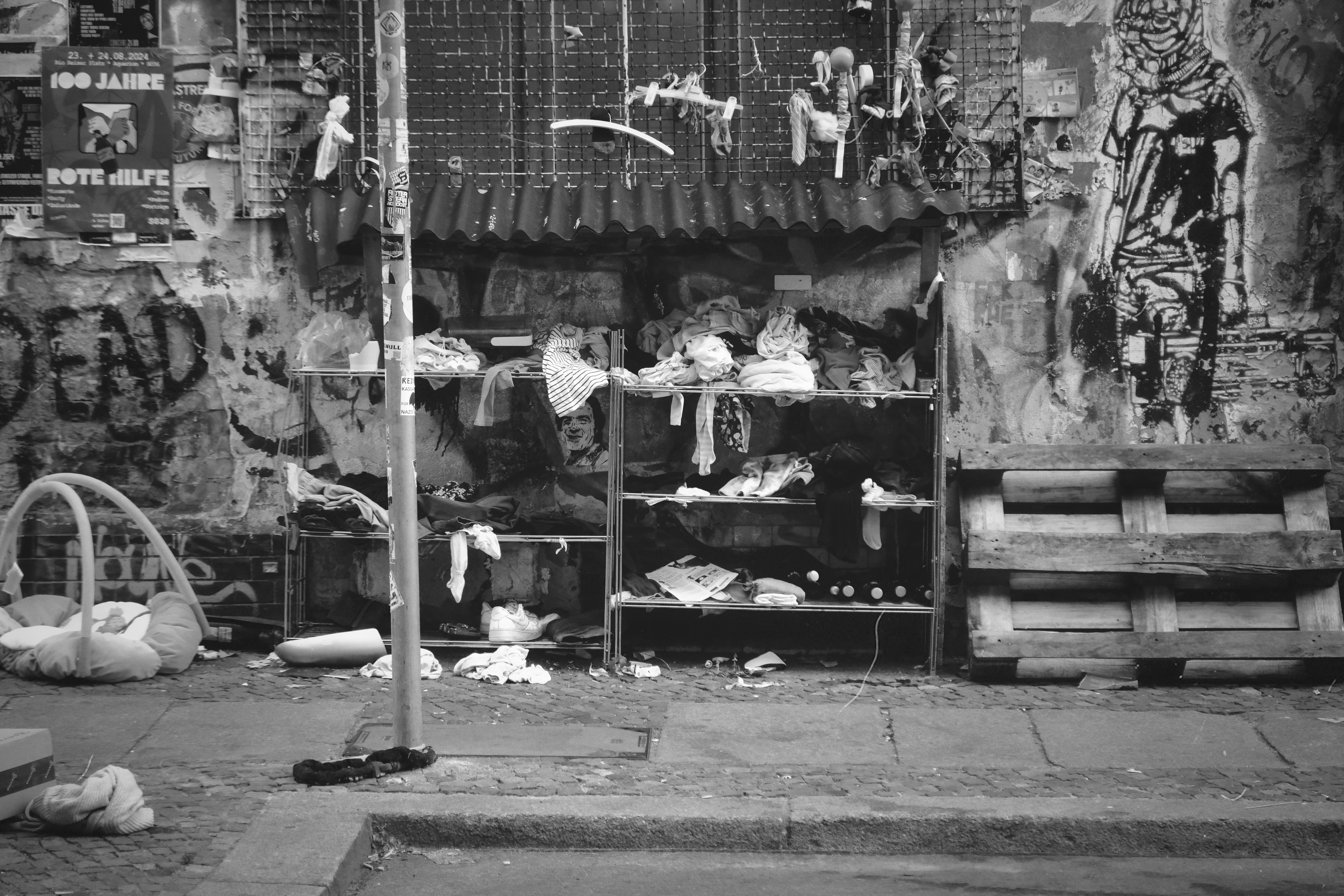 A black and white photo of a street corner - mess - a-black-and-white-photo-of-a-street-corner-gUEIGmRM_tg