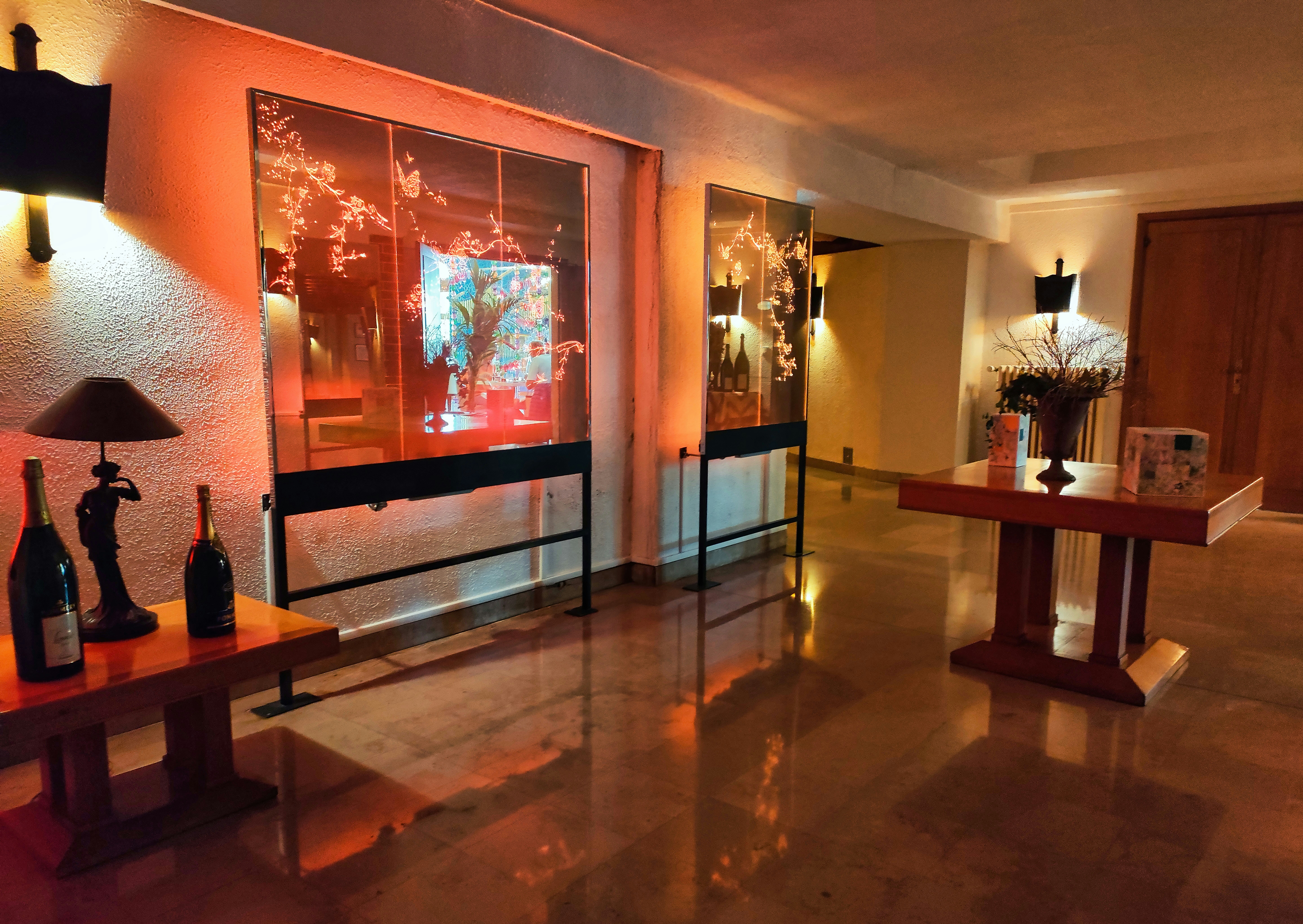 A room that has a table with bottles on it