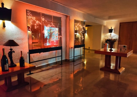 A room that has a table with bottles on it