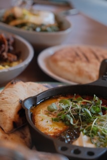 A table topped with lots of different types of food