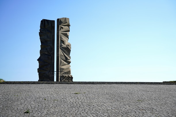 A couple of large rocks sitting on top of a road