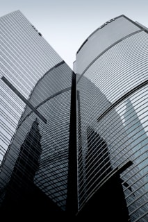 A couple of tall buildings sitting next to each other