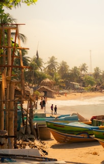 A group of boats sitting on top of a sandy beach