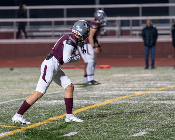 American football resting on the field
