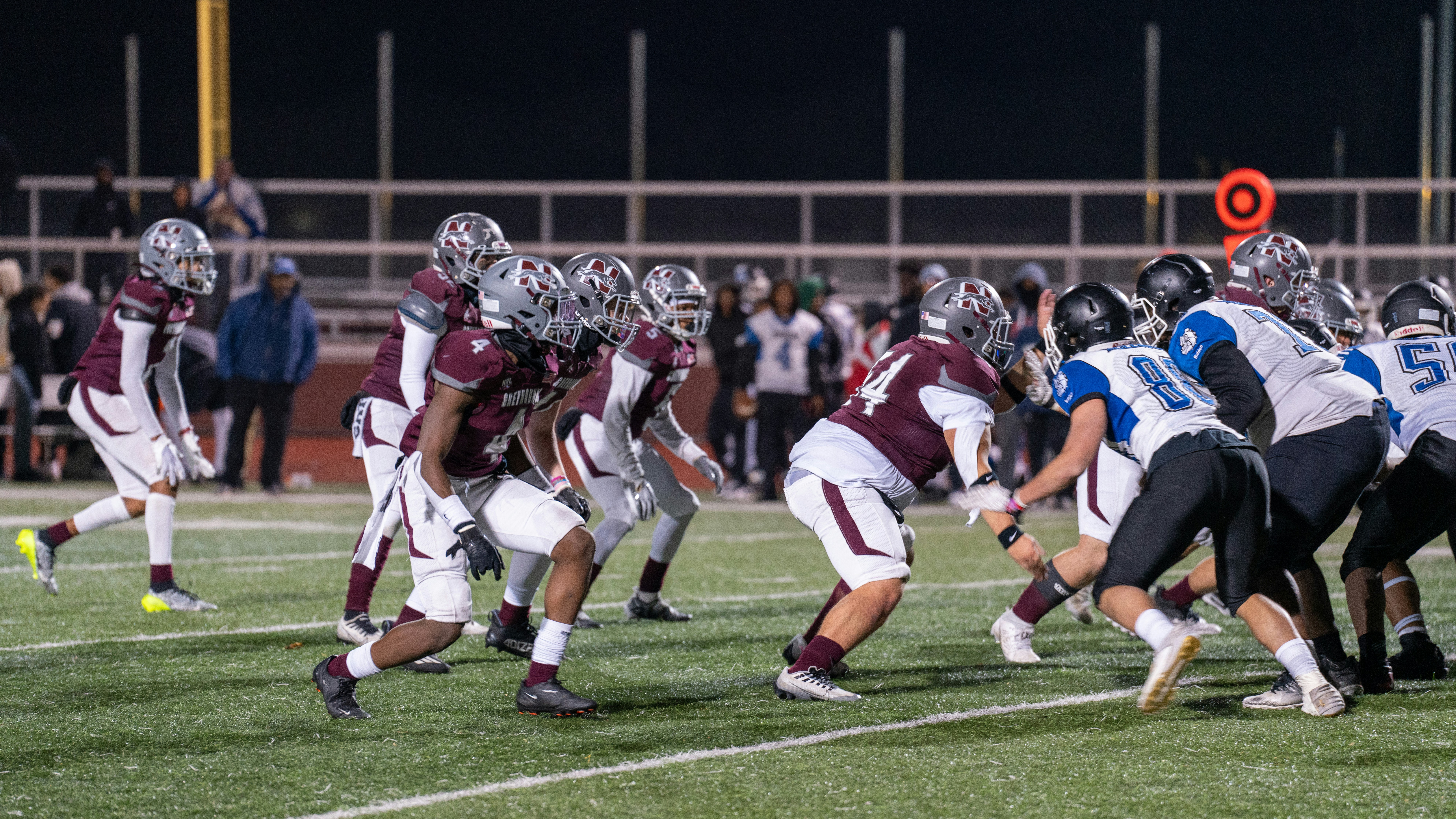 A group of people playing a game of football