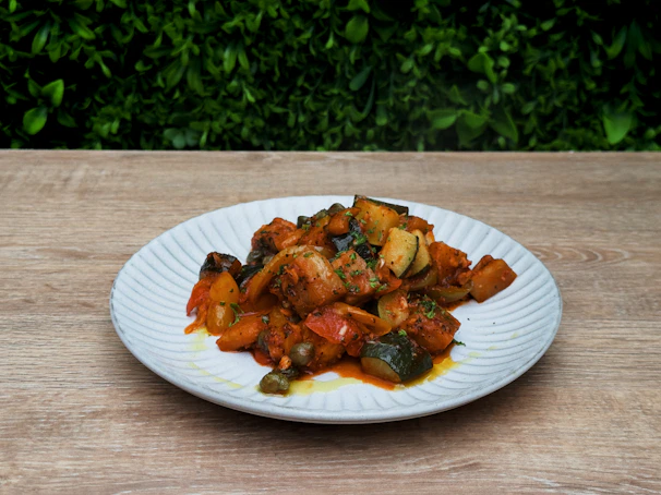A plate of food on a wooden table