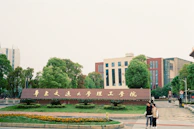A woman standing in front of a tall building