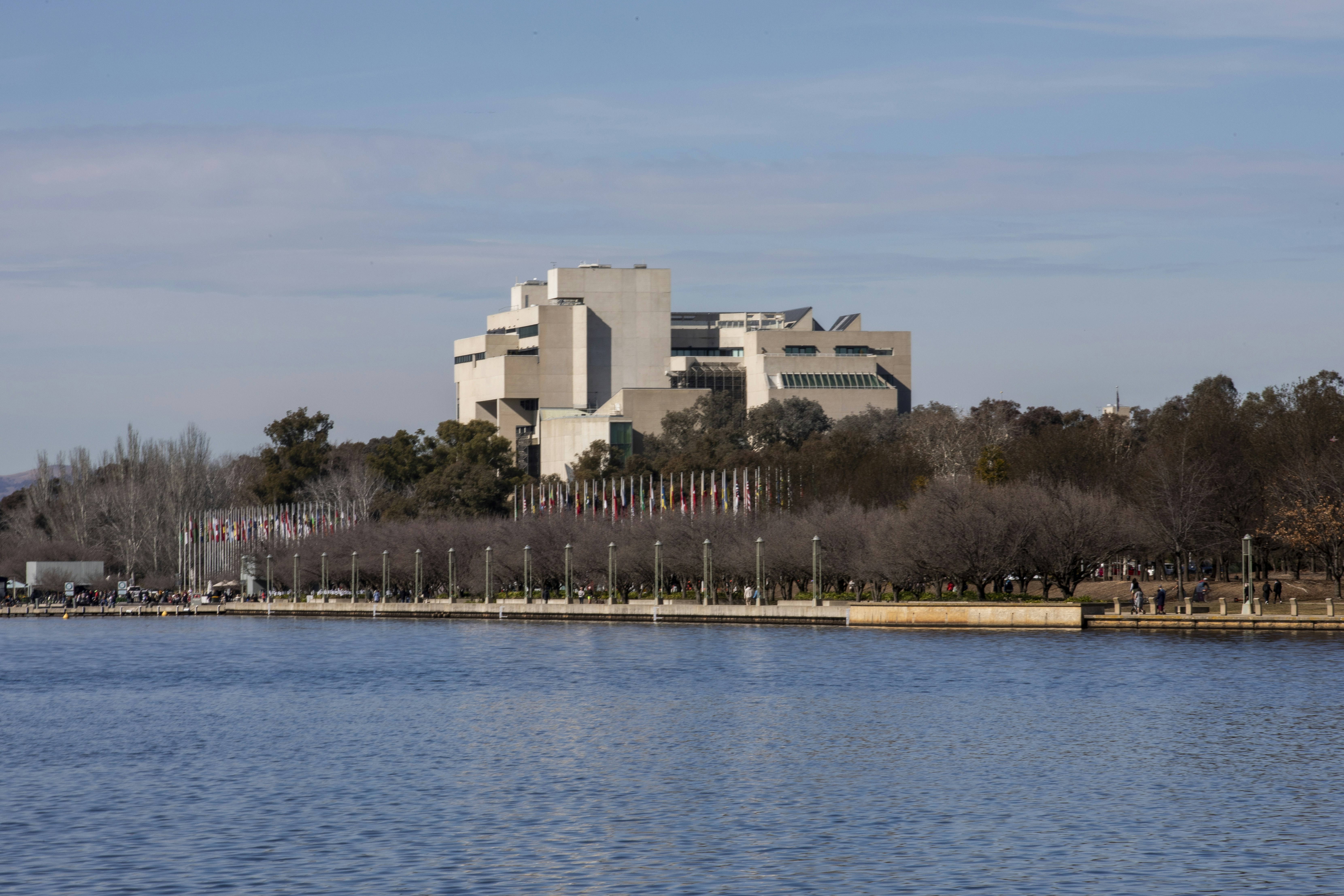 A large body of water with a building in the background