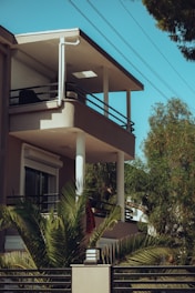 A tall building with a balcony and balconies