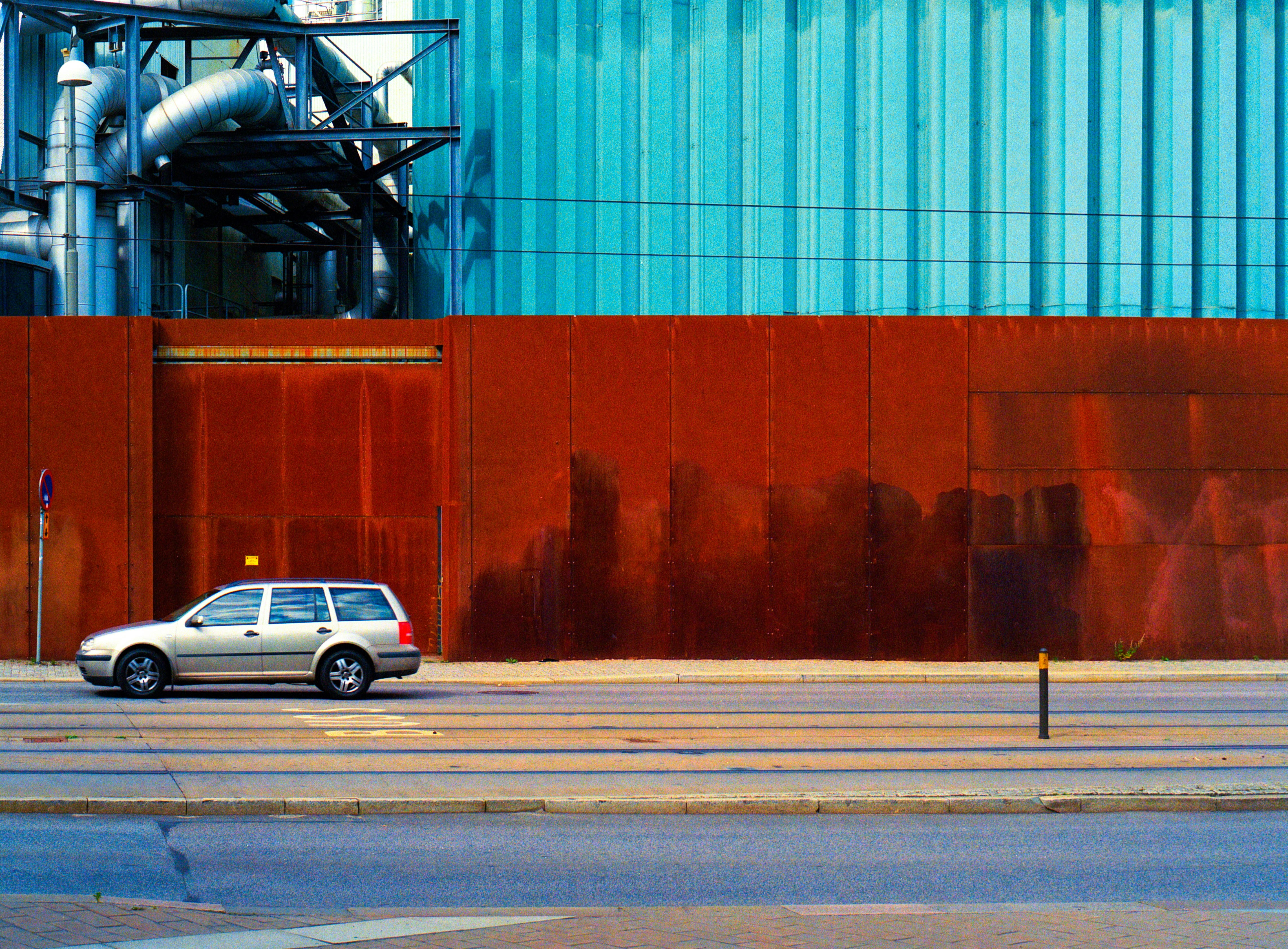 A car is parked in front of a building