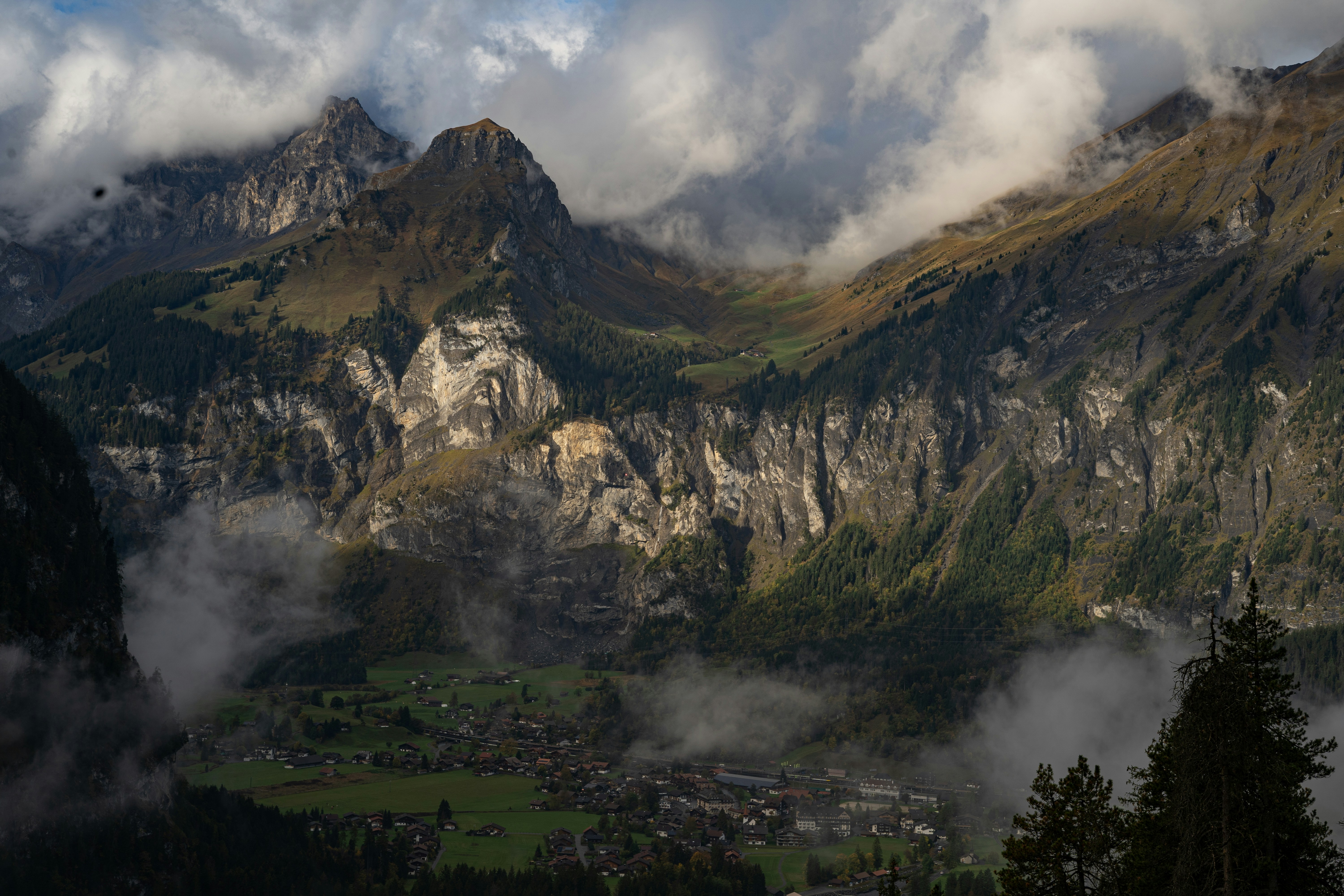 A view of a mountain range covered in clouds