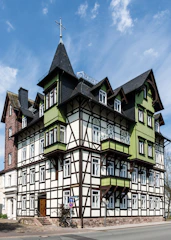 A large building with many windows on the side of it