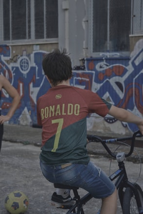 A couple of people that are on a bike