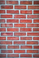 A close up of a red brick wall