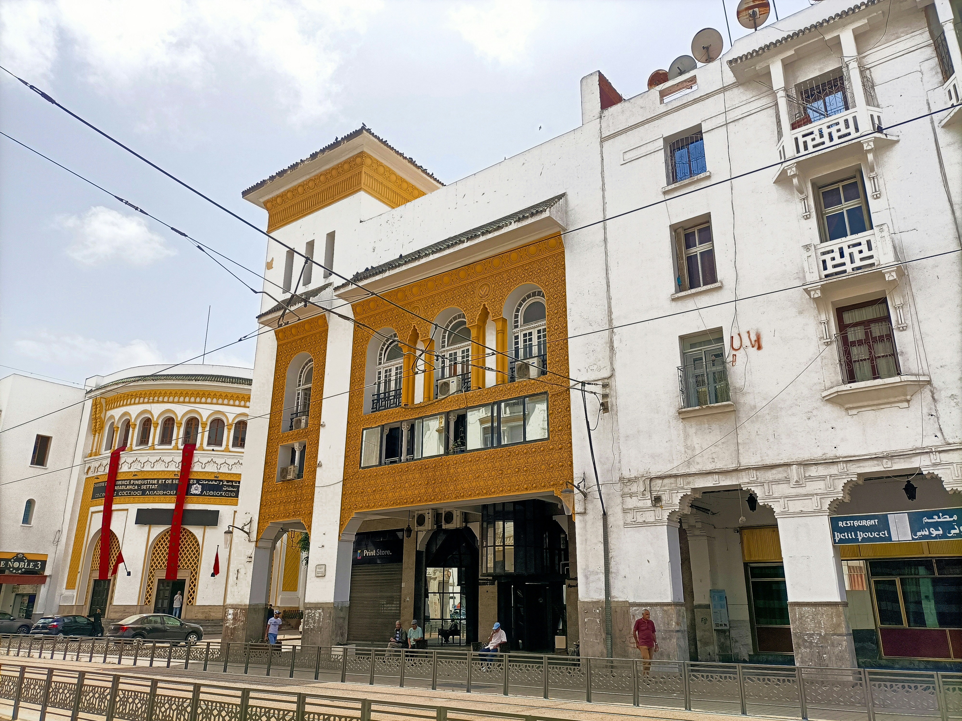 A row of white and yellow buildings next to each other