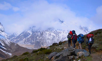 A group of people hiking up a mountain