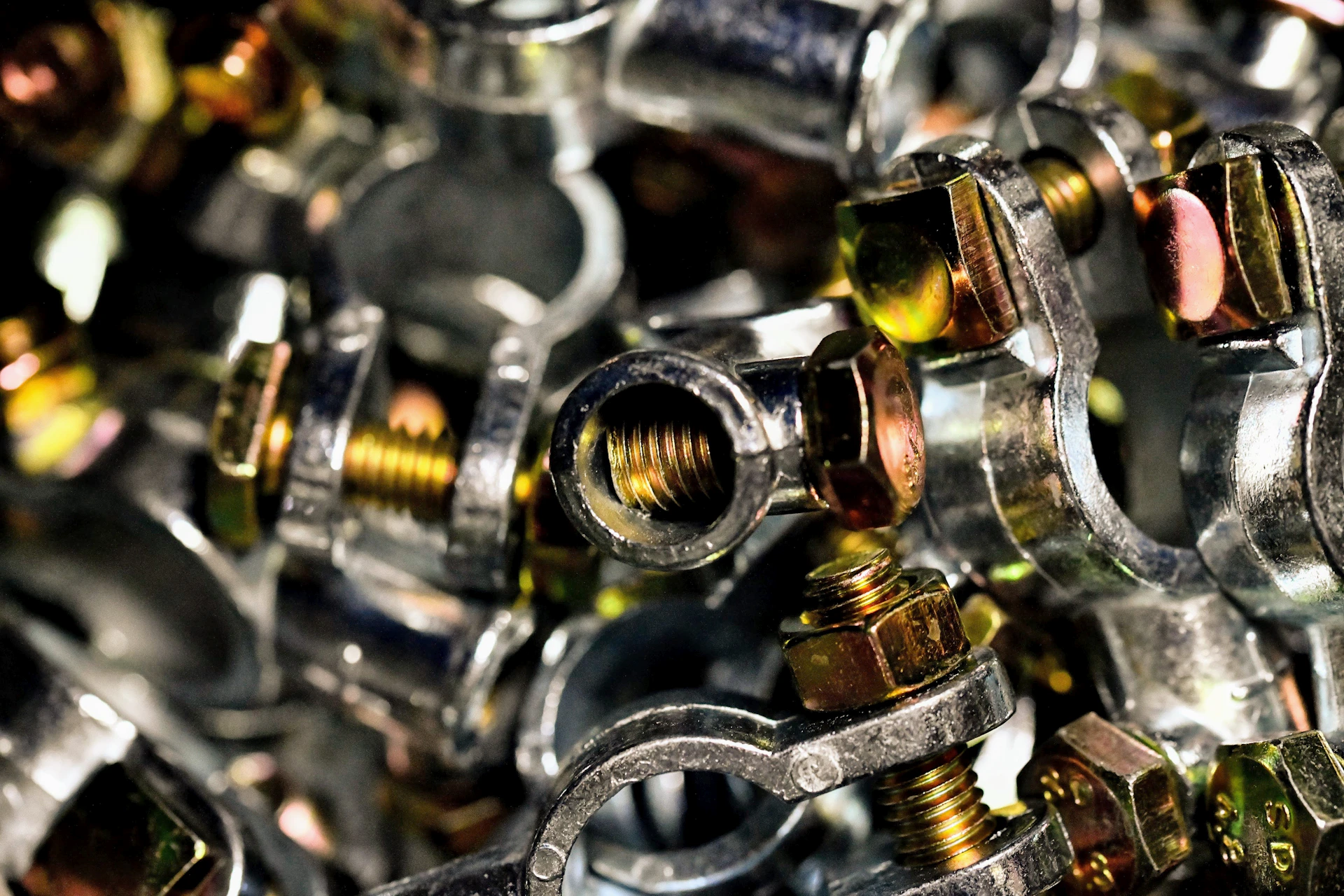A pile of metal fittings and nuts
