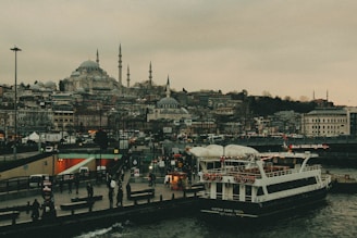 A large white boat floating on top of a body of water