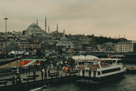 A large white boat floating on top of a body of water