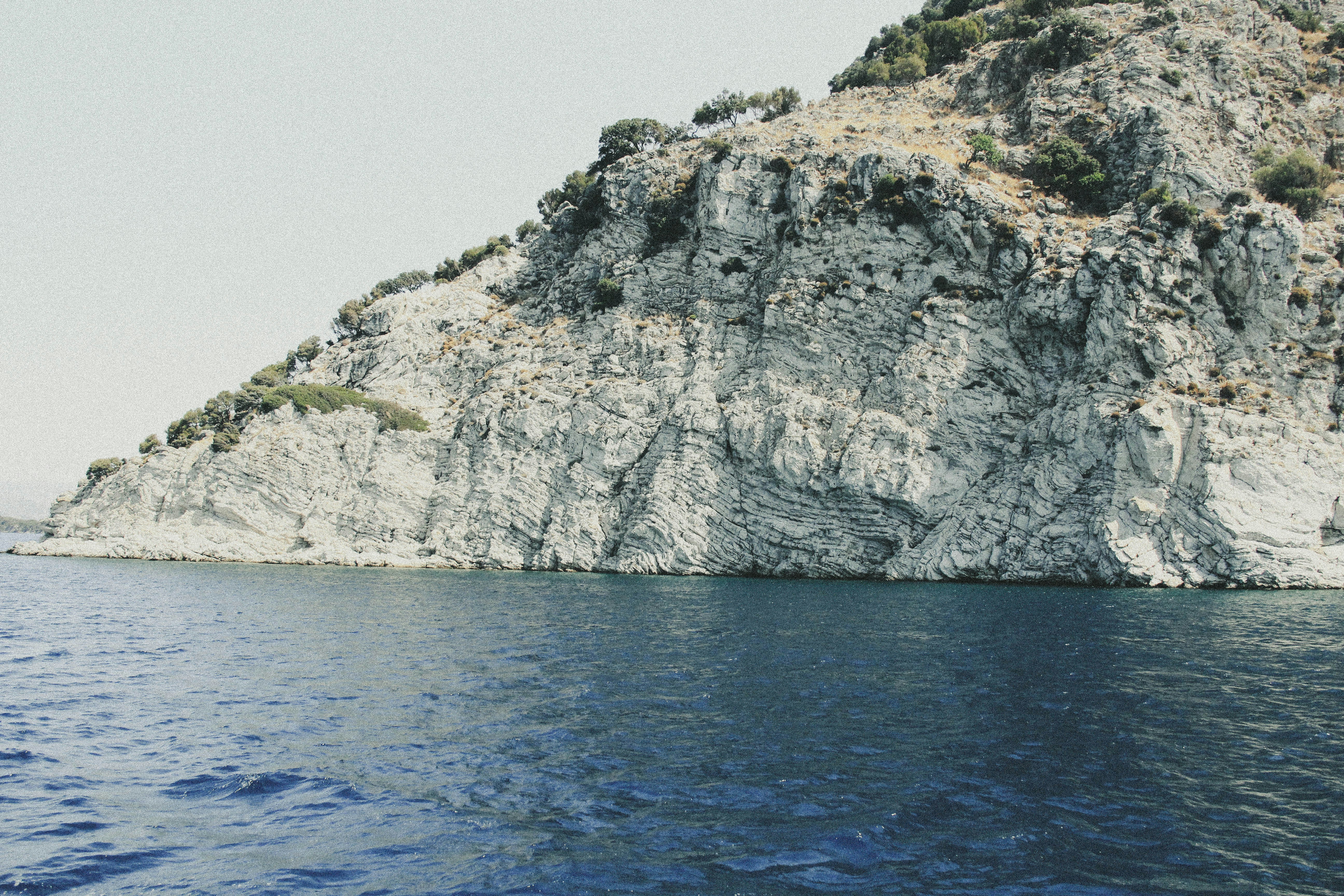 A rock outcropping in the middle of the ocean