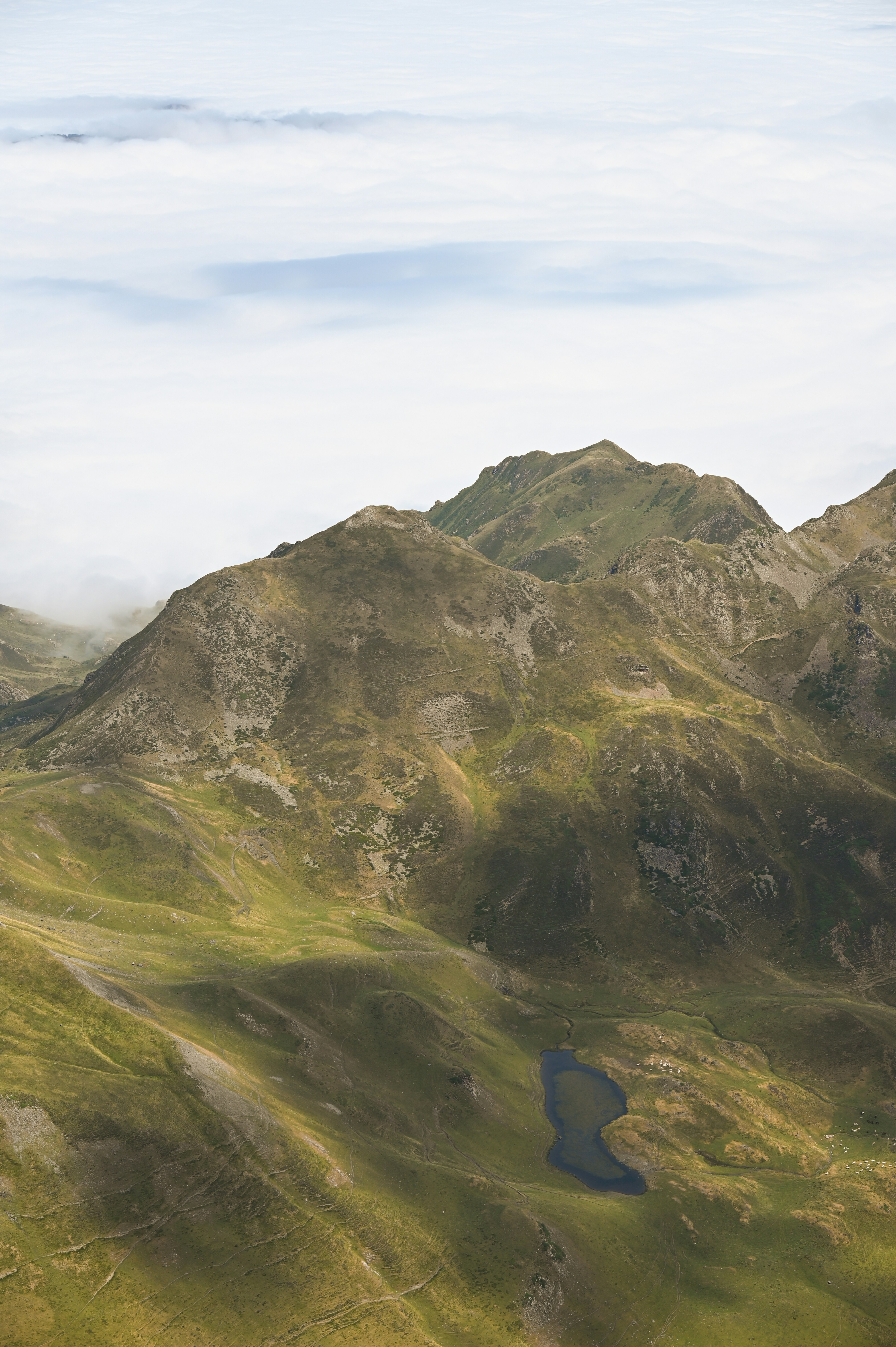 A mountain range with a lake in the middle of it
