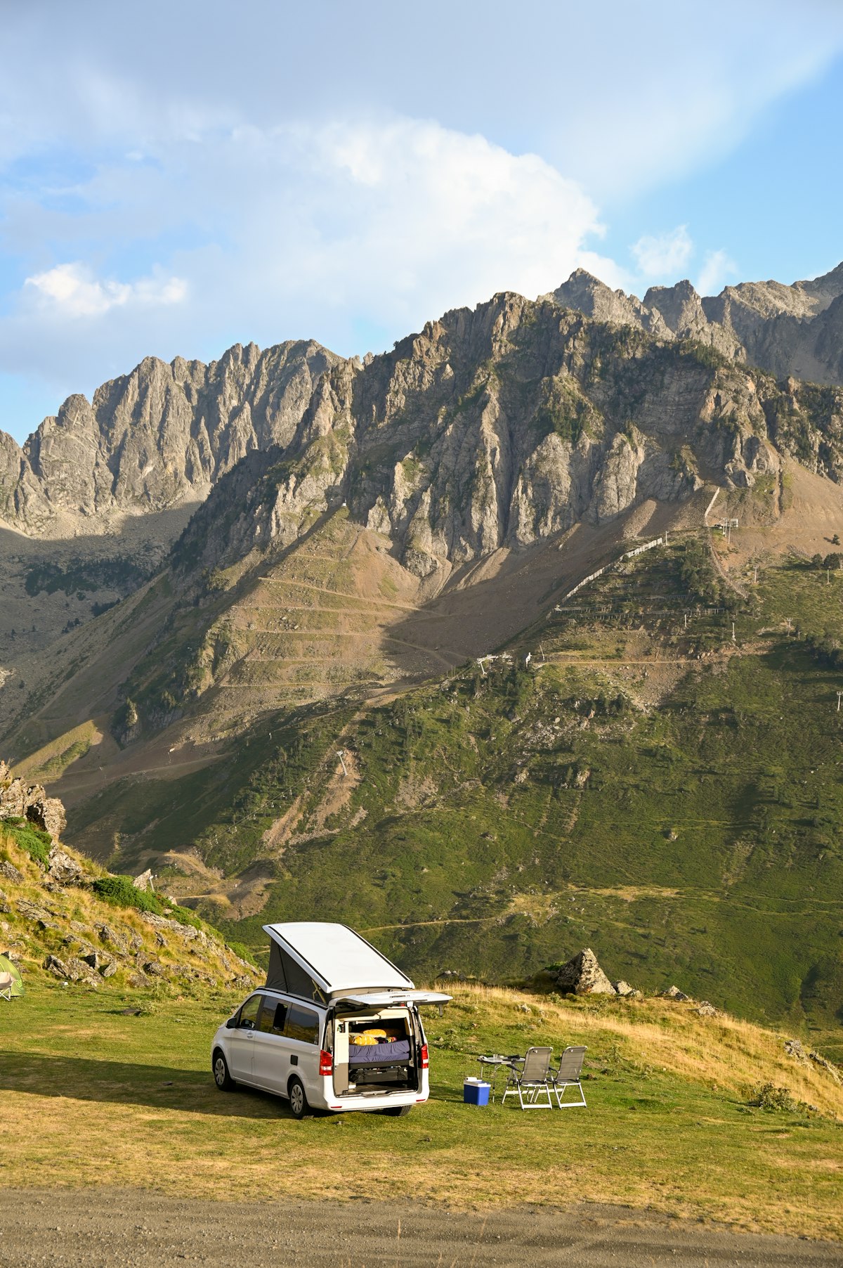 A campervan set up for the night in the mountains — the Georgian version of this comes with fewer neighbours