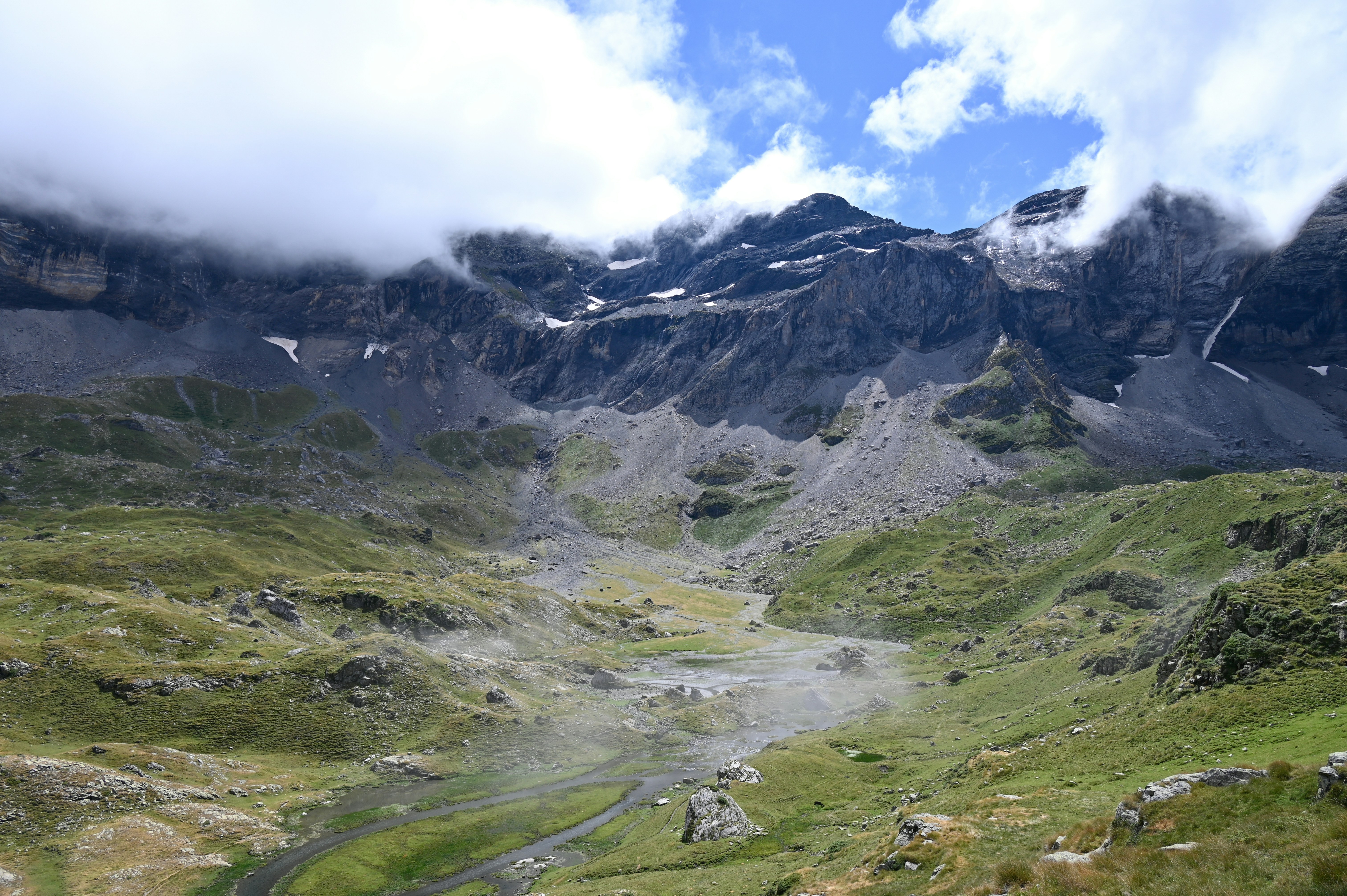 A view of a mountain with a river running through it