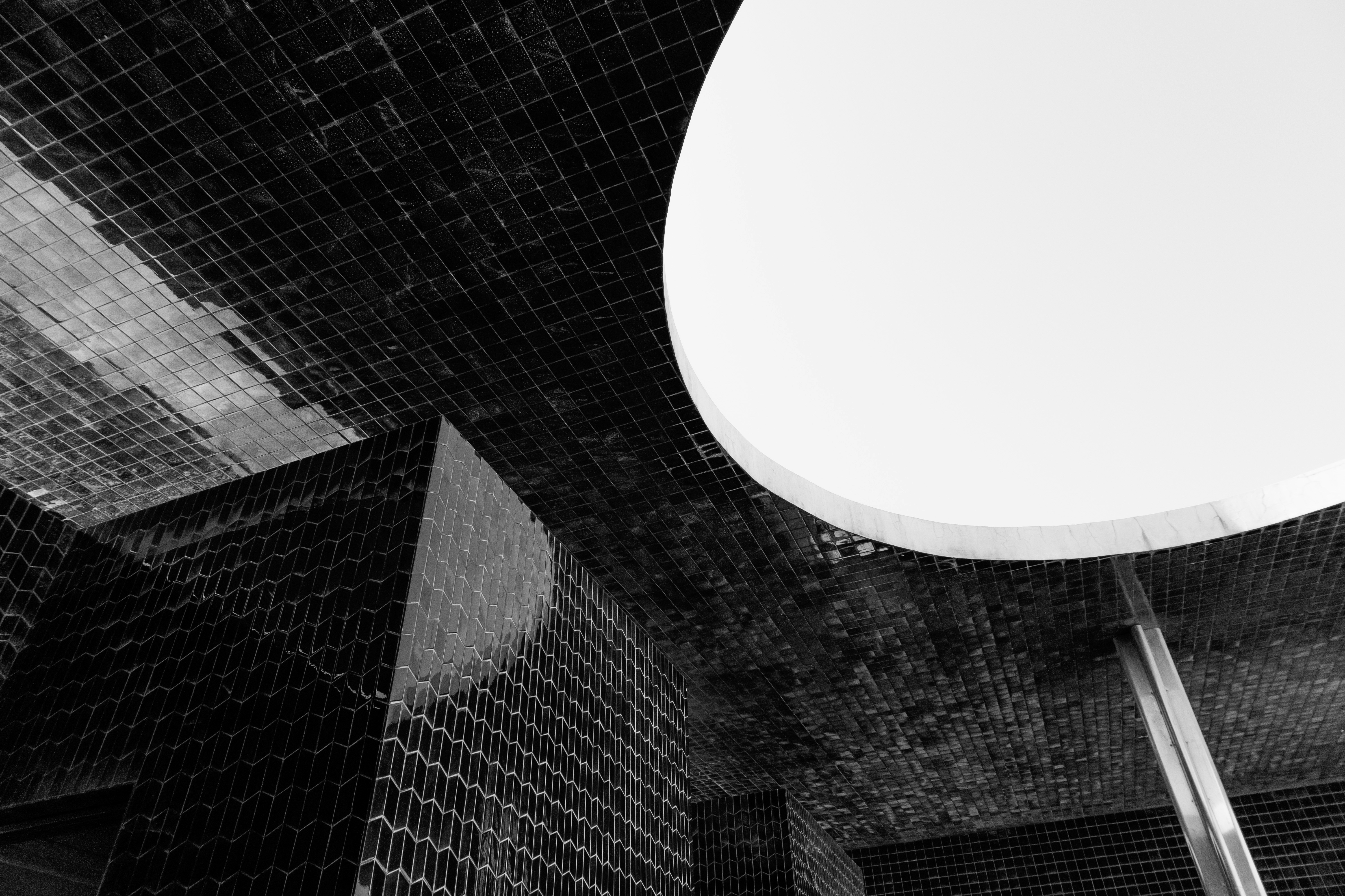 A black and white photo of a toilet in a bathroom
