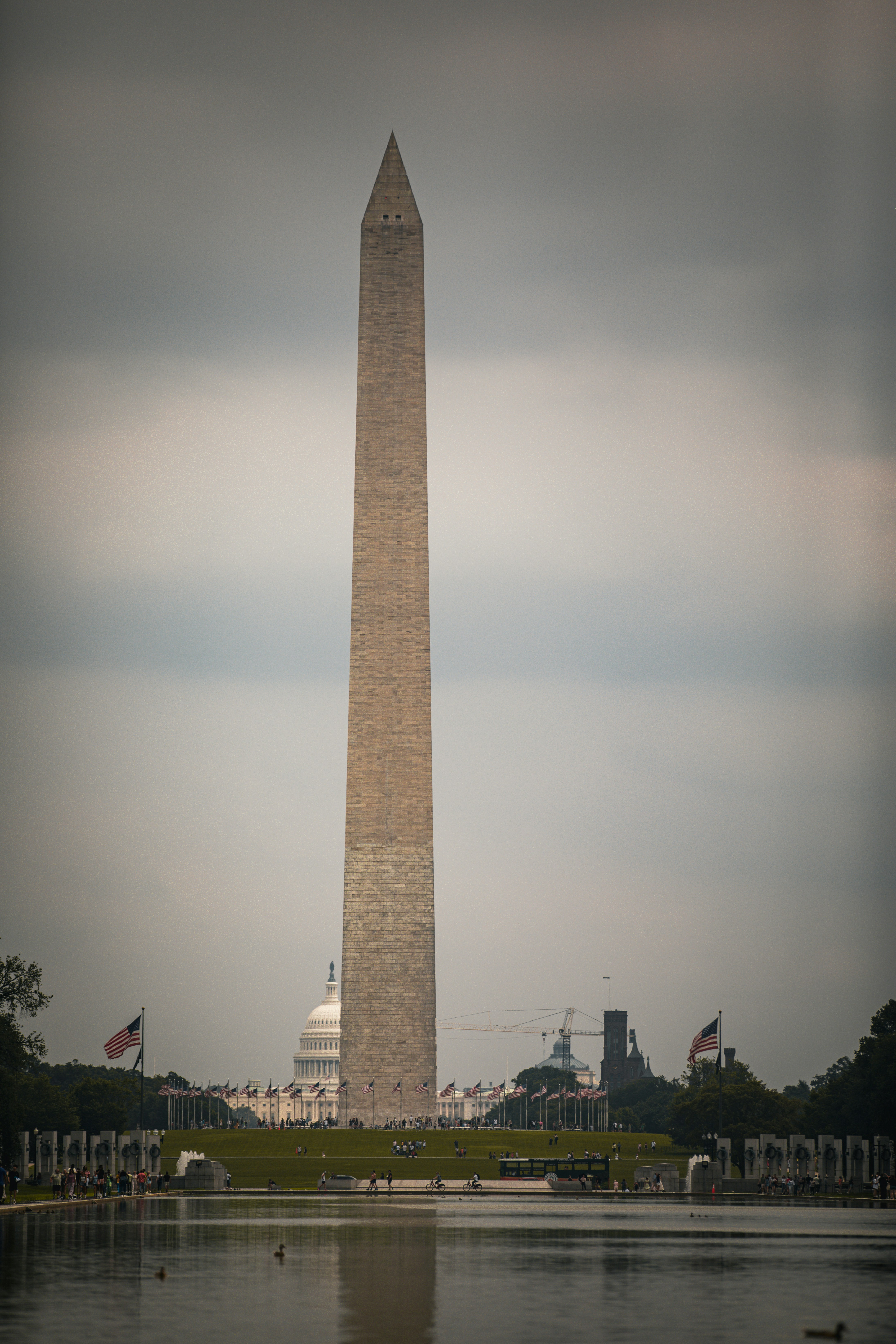 The washington monument in washington dc with a reflection in the water