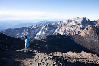 A person standing on top of a mountain