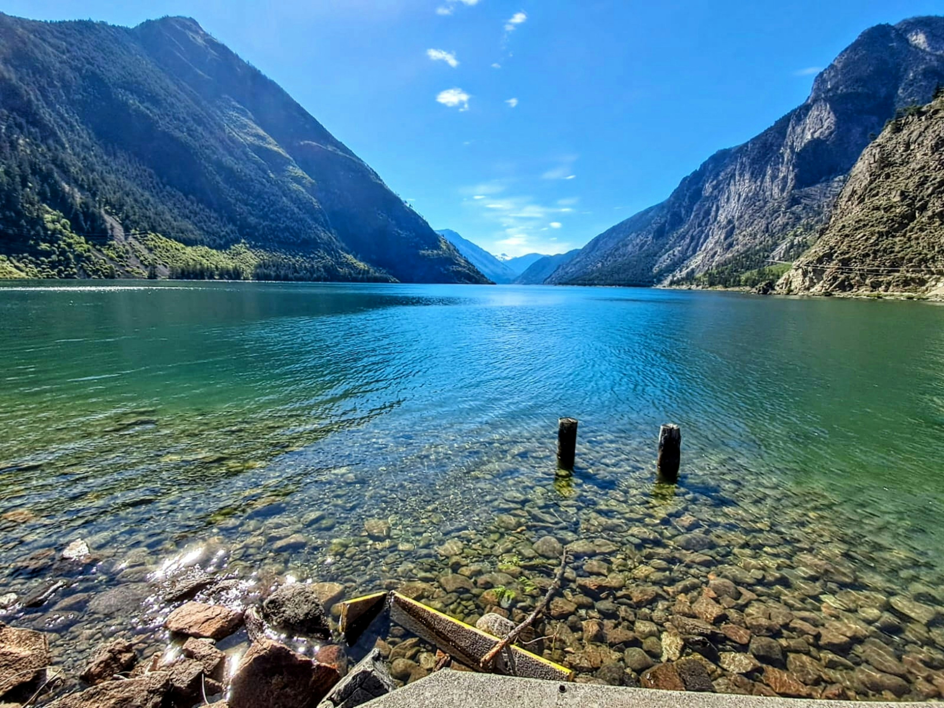 A body of water surrounded by mountains and rocks