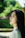 A woman with long black hair and a white shirt