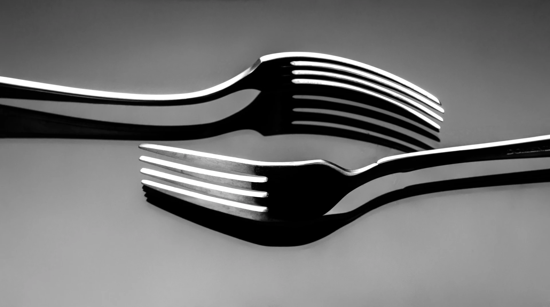 A black and white photo of a fork and knife