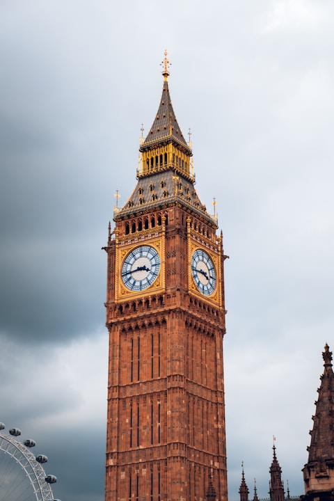 A tall clock tower with a sky background