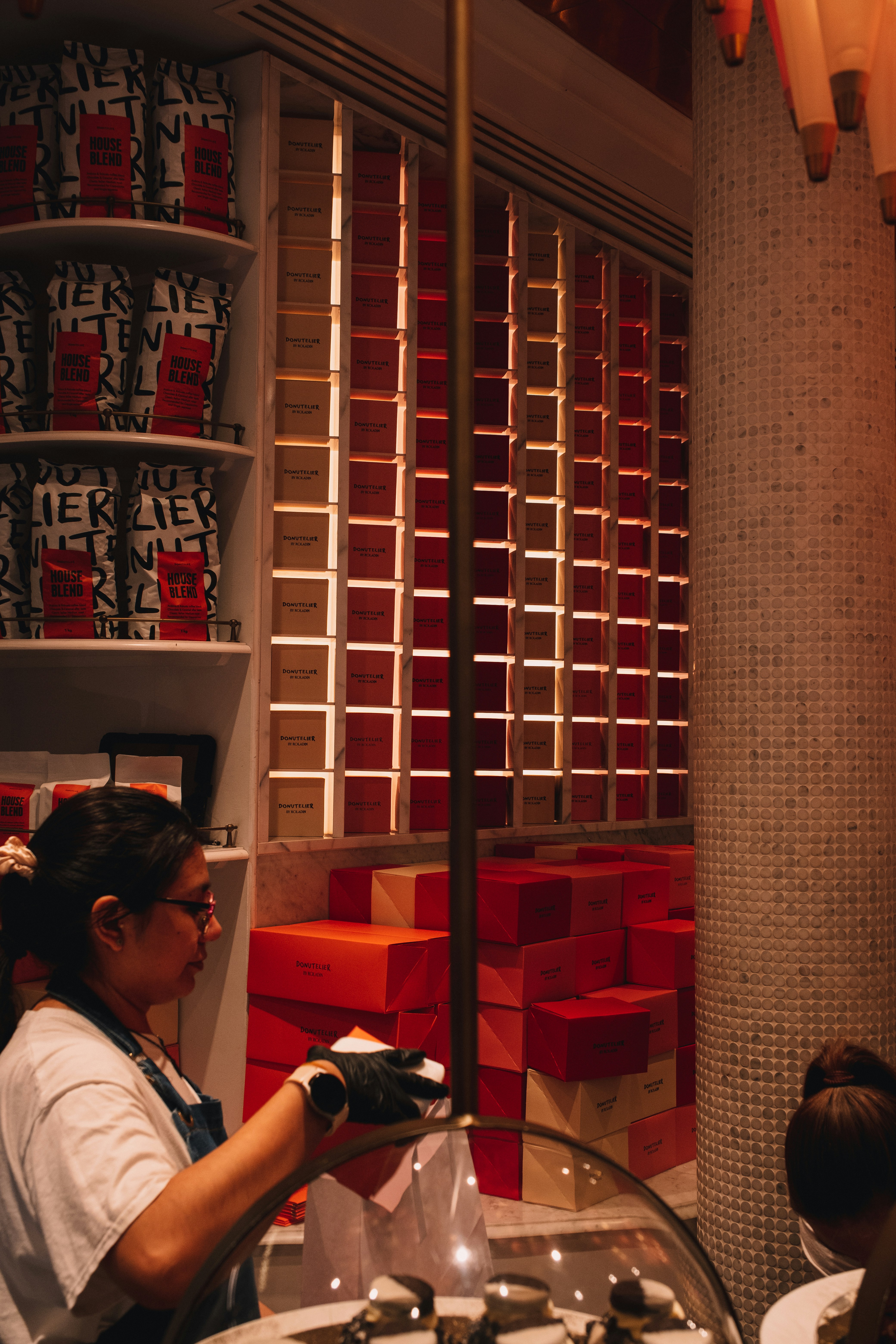 A woman standing in front of a sink in a bathroom