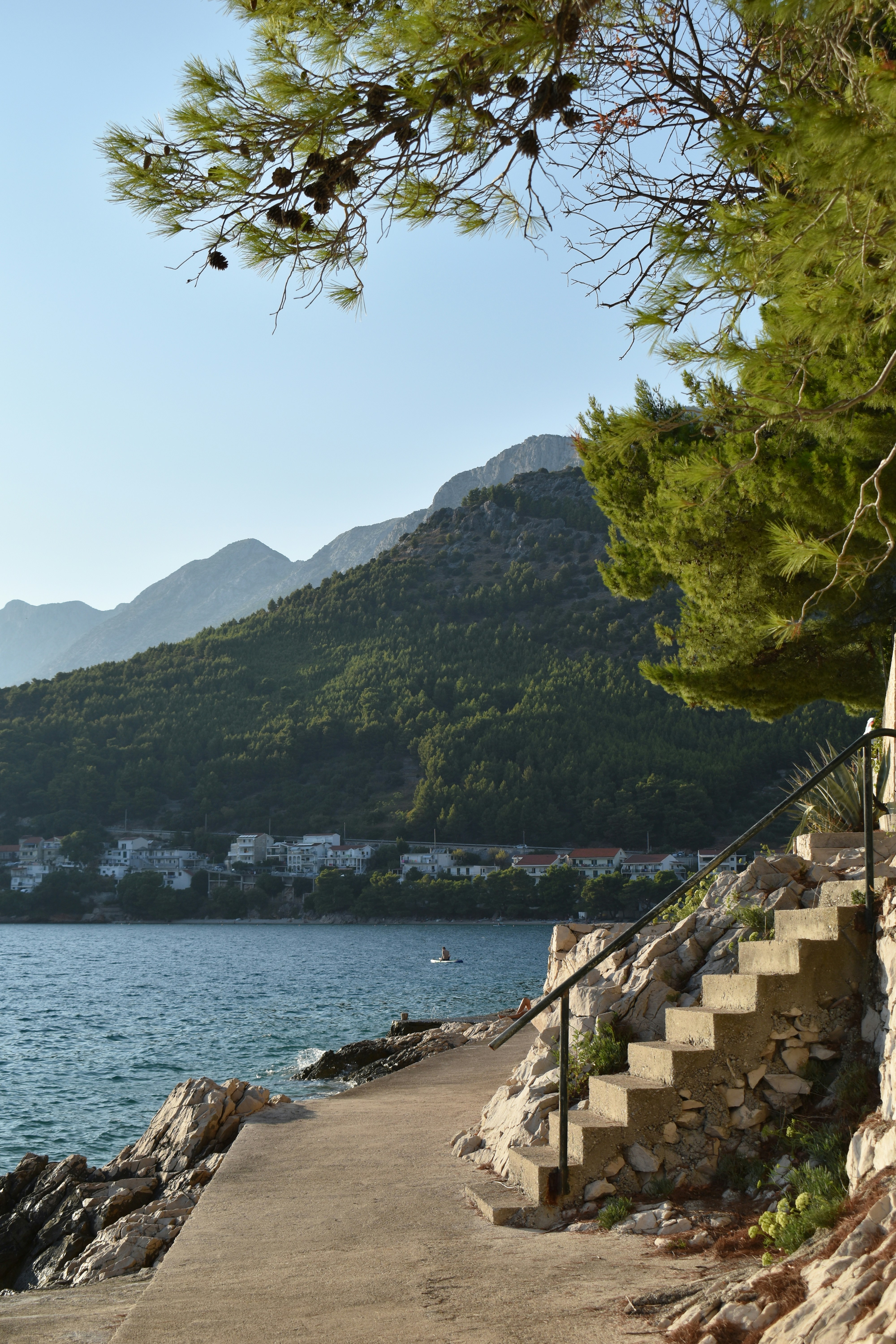 A view of a body of water from a rocky shore