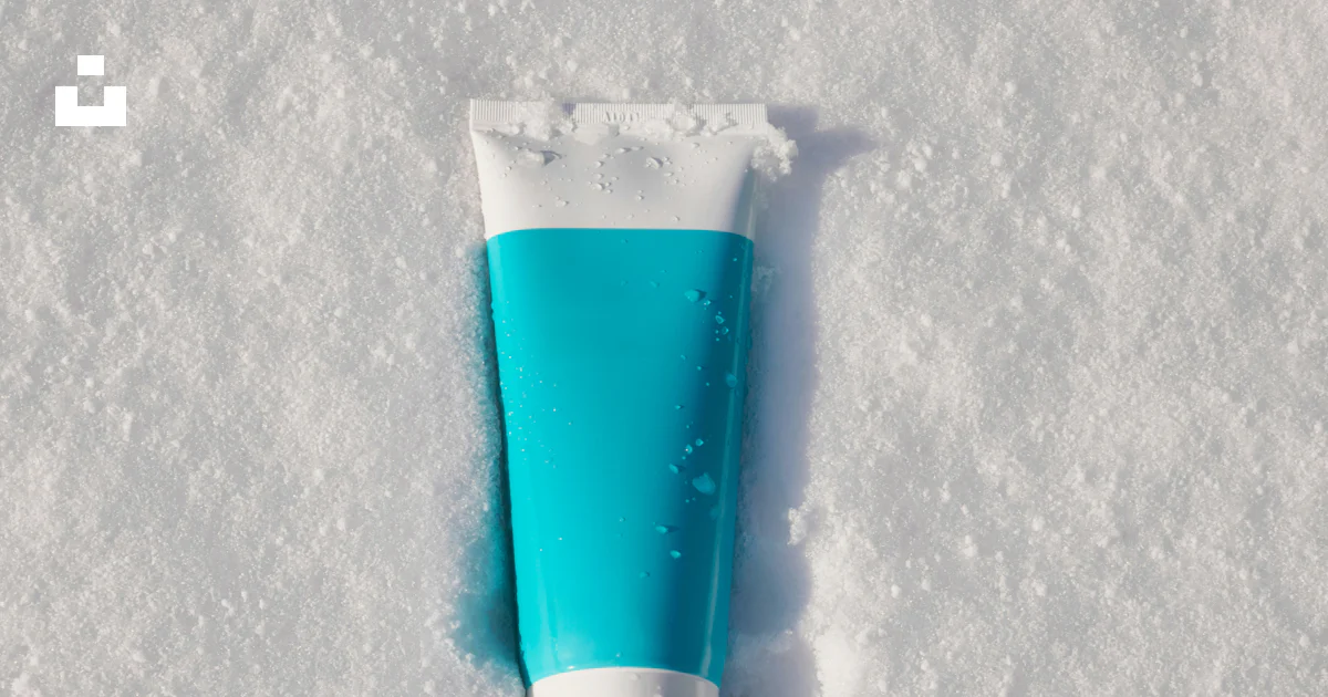 A tube of toothpaste sitting in the snow photo – Free Bottle Image on ...