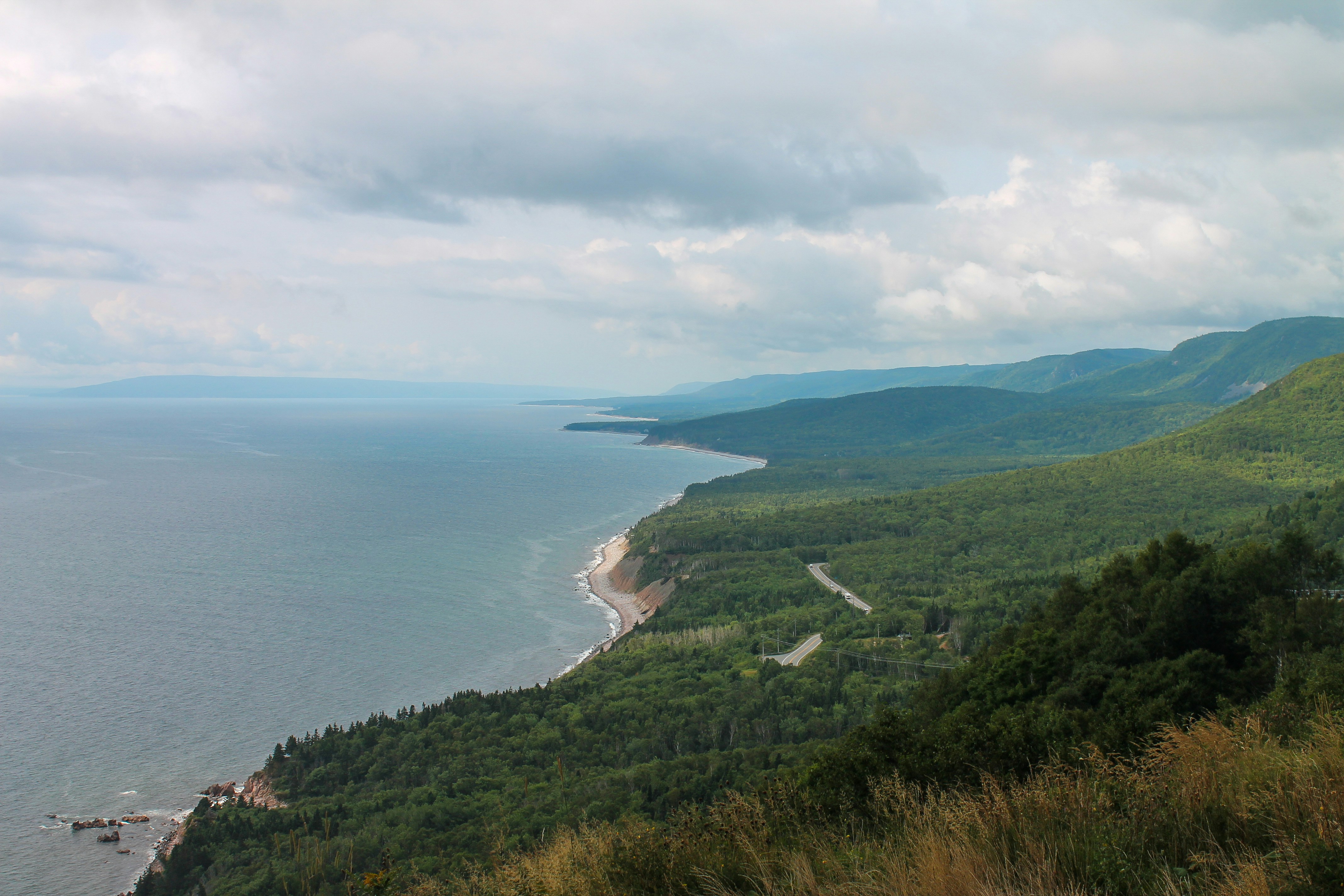 A scenic view of the ocean from a hill