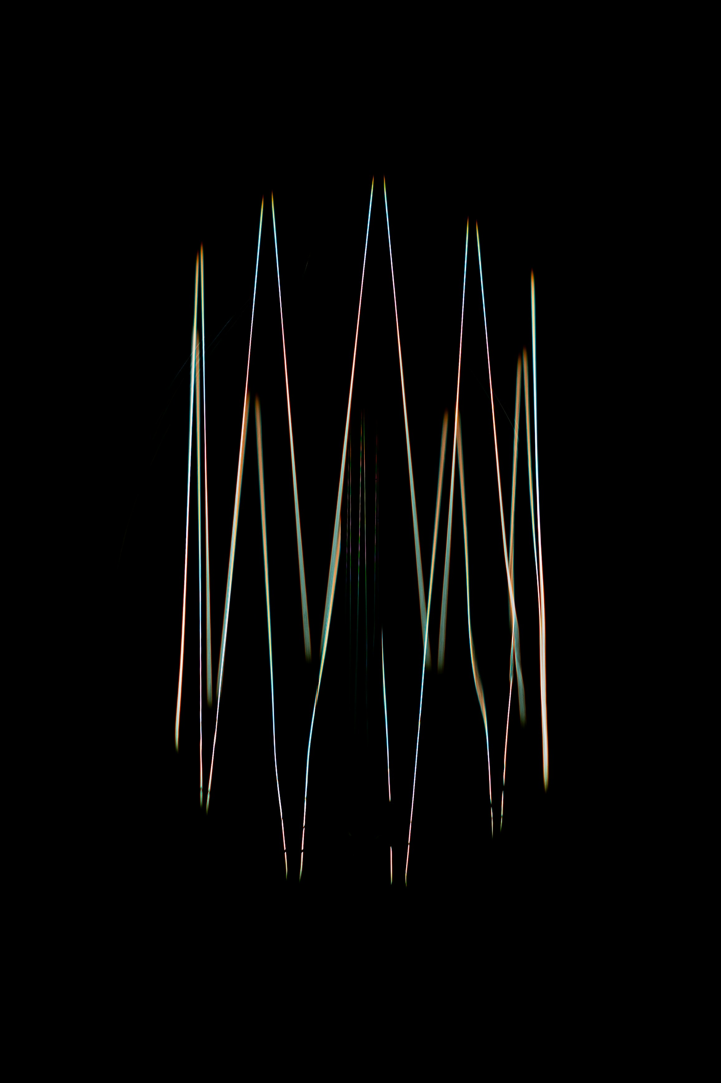 A blurry image of a bunch of sticks in the dark