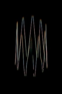 A blurry image of a bunch of sticks in the dark