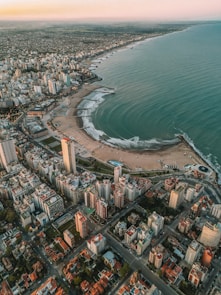 An aerial view of a city next to the ocean