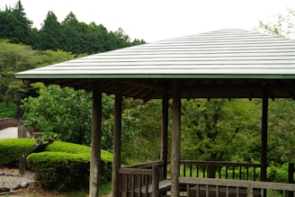 A gazebo with a bench in the middle of it