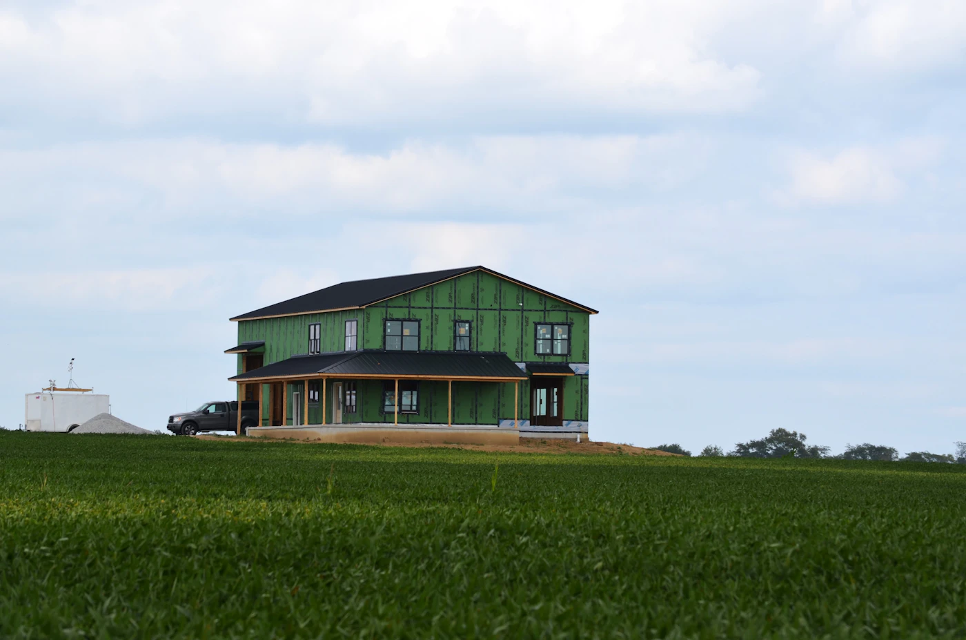 House standing alone in an open green field
